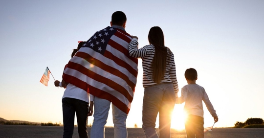 family with US flags